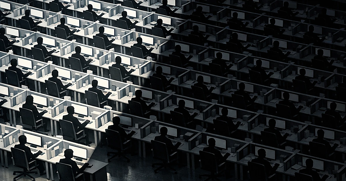 Aerial view of office desks with silhouetted workers, half cast in shadow representing job protection changes