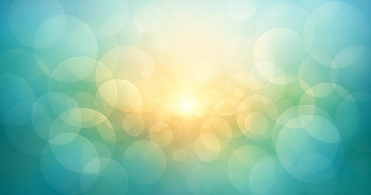 Abstract overlapping circles in blue and green with warm golden center light representing healthcare and compassion